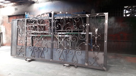 Sliding gate with scroll work